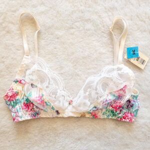 Vintage white lace bralette with pink and green floral details. Size 34